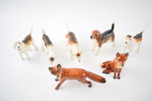 Beswick to include a beagle, 4 various foxhounds and 2 foxes (7). In good condition with no