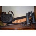 A collection of shooting related items to include leather cartridge belt, leather cartridge bag,