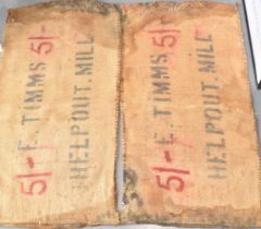 Two vintage corn sacks (red writing) E. TIMMS HELP OUT. MILL 130cm x 70cm (2) In vintage condone