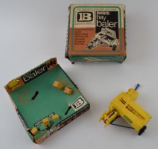 A boxed vintage diecast Britains Models, Bamfords (JCB) Hay Baler. Complete with hay bails.