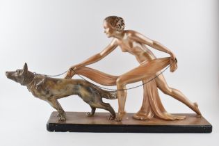 Art Deco 1930s plaster figure of a girl walking a dog, with registration number, 74cm long.