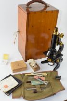W. Watson & Sons Kima microscope along with assorted microscope slides, a travelling scientific