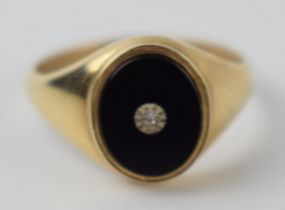 9ct gold onyx and diamond gents ring, 2.7 grams, size U.