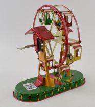 Tinplate clockwork Ferris wheel marked JW Germany (Wagner Brunn) with key. Height 23cm. In working