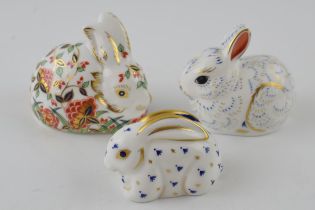 Three Royal Crown Derby paperweights, Collectors Guild Exclusives Meadow Rabbit and Bunny, red