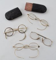 A collection of rolled gold Georgian style spectacles and associated case (Qty).