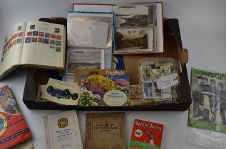A mixed collection of ephemera to include, Staffordshire FA handbook 1960 - 61, postcard albums, tea