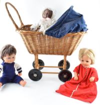 A vintage wicker childs pram with Tiny Tears and Tiny Tim dolls together with an additional doll (4)