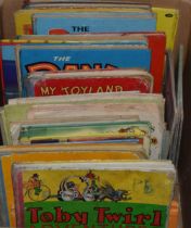 A quantity of vintage childrens annuals to include titles, Toby Twirl, The Dandy, Jolly and