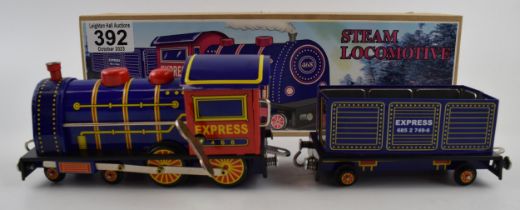 Tinplate clockwork Steam Locomotive in box with key. Height 9cm. In working order.