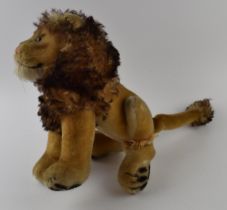 Vintage Steiff straw-filled male lion. Height 27cm. Damage to rear left leg.