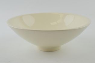 Norman Wilson for Wedgwood: a cream ware pedestal bowl of modernist form, 23cm diameter, impressed