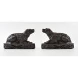 Pair of small antique dog door stops. English, cast iron decorative bookend or doorstopper in