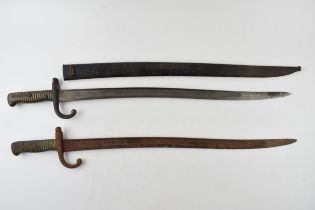 19th century French Chassepot bayonet in scabbard together with another similar example without