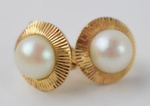 Gold (tests as 9ct or better) pair of cultured pearl set earrings, 3.3 grams.