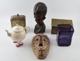 Interesting items to include a carved tribal bust, a tribal wooden mask, a Crawfords biscuit tin,