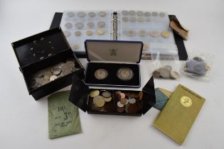 A collection of coins of varying ages and denominations from the UK and across the world, some in an