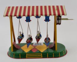 Tinplate clockwork fairground boats ride marked JW Germany (Wagner Brunn) with key. Height 18cm.