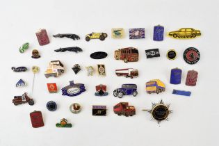 A collection of enamel badges relating to cars and motoring to include Michelin man, Lucas, Guy