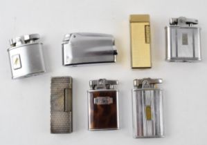 A collection of vintage lighters to include four Ronson examples and of note a Dunhill Rollagas. (7)