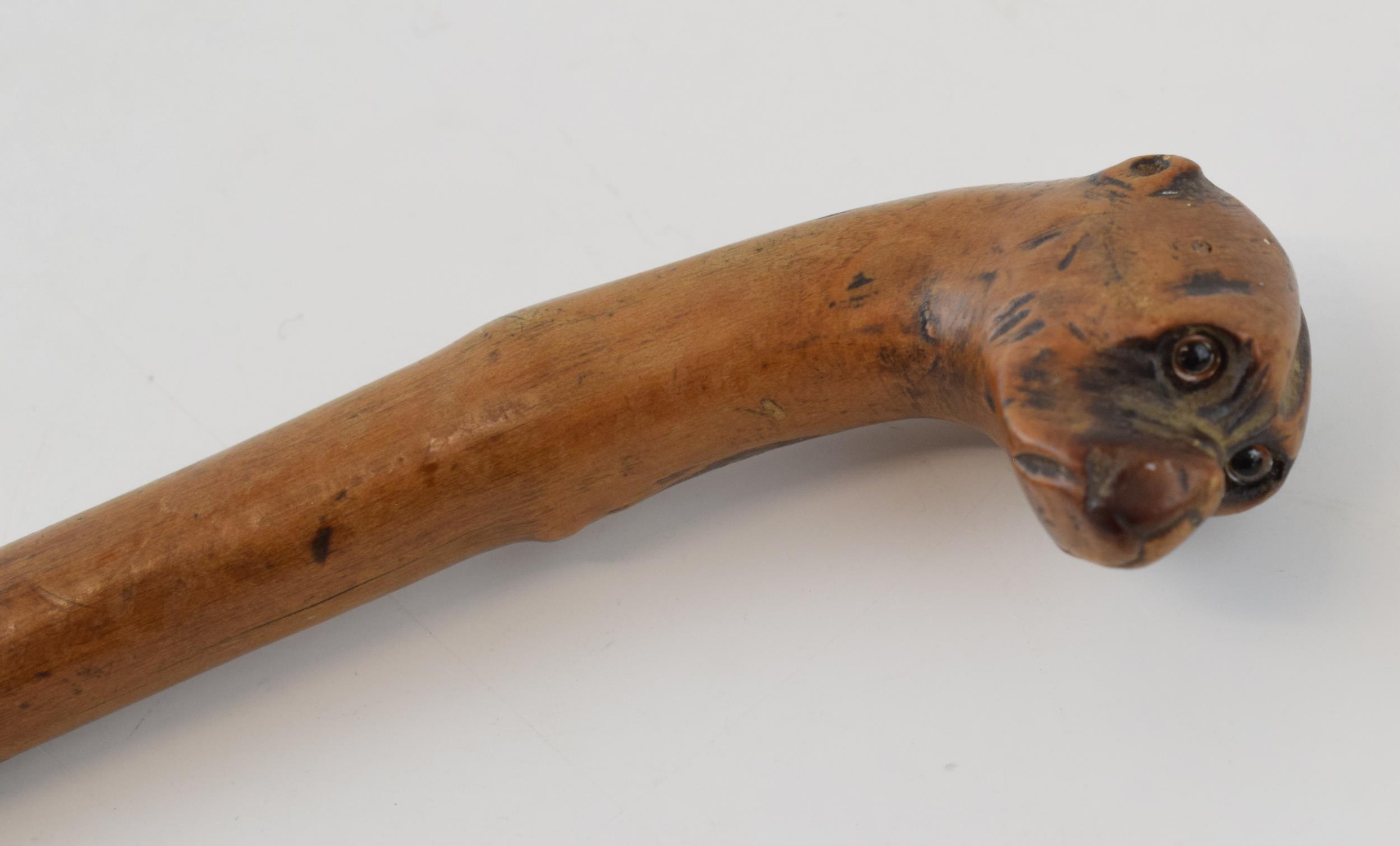 Folk Art walking stick with naively carved head on a Boxer dog with glass eyes and original