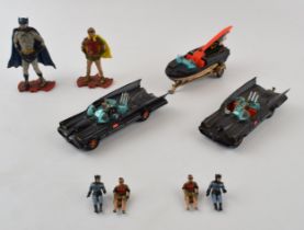 Vintage diecast model Corgi Batmobiles (2) together with a Batmobile speedboat all 3 vehicles are