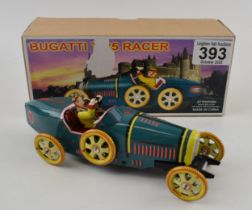 Tinplate clockwork Bugatti racing car in box with key. Height 7cm. In working order.