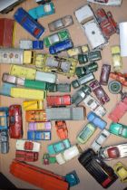 A collection of unboxed vintage die-cast model vehicles by manufacturers Dinky, Corgi and Matchbox