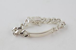 Silver curb link bracelet marked 925 Italy. Length including clasp 24.5cm. Weight 88.3g. In good