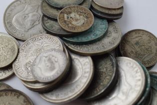 A collection of silver coins to include 305 grams of 1920-1946 coins and 5 grams of pre-1920