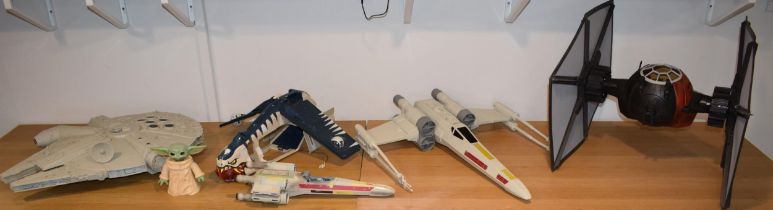 A good quantity of Star Wars toys including X Wing Fighters, Yoda figure and various other related