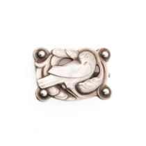 Georg Jensen silver 'Dove' brooch designed in 1904 by Kristian Moehl-Hansen. Framed by stylised