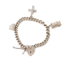 Silver charm bracelet with charms to include a car, a cross and others, 34.7 grams.