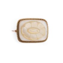 Yellow metal brooch (tests as circa 18ct) with carved Mother of Pearl decoration in the form of a