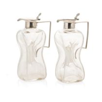 A pair of silver and glass noggins / glug glug jugs, Birmingham 1913, HB & Co, 12cm tall (2). In