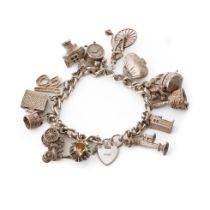 Silver charm bracelet with various charms to include a a bible, a purse, a bell, a telephone and