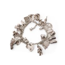 Silver charm bracelet with various charms to include an astronaut, a pair of binoculars, a bell