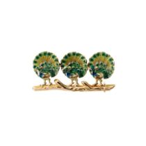 18ct gold brooch in the form of three peacocks, on a branch, with enamelled decoration, 35mm wide,