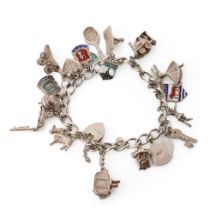 Silver charm bracelet with various charms to include a tennis racket, a film camera, a train, a lady