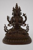 Reproduction bronzed Tibetan figure of a praying buddah, 10cm tall.