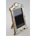 Hallmarked silver fronted photo frame with wooden easel back, London 2022, 21cm tall.
