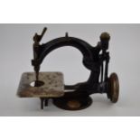Willcox and Gibbs sewing machine, of New York, cast iron, 26cm long.
