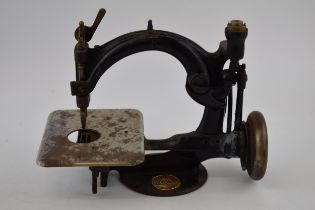 Willcox and Gibbs sewing machine, of New York, cast iron, 26cm long.