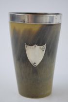 Edwardian horn beaker with silver rim, London 1918, silver shield to front, 10cm tall.