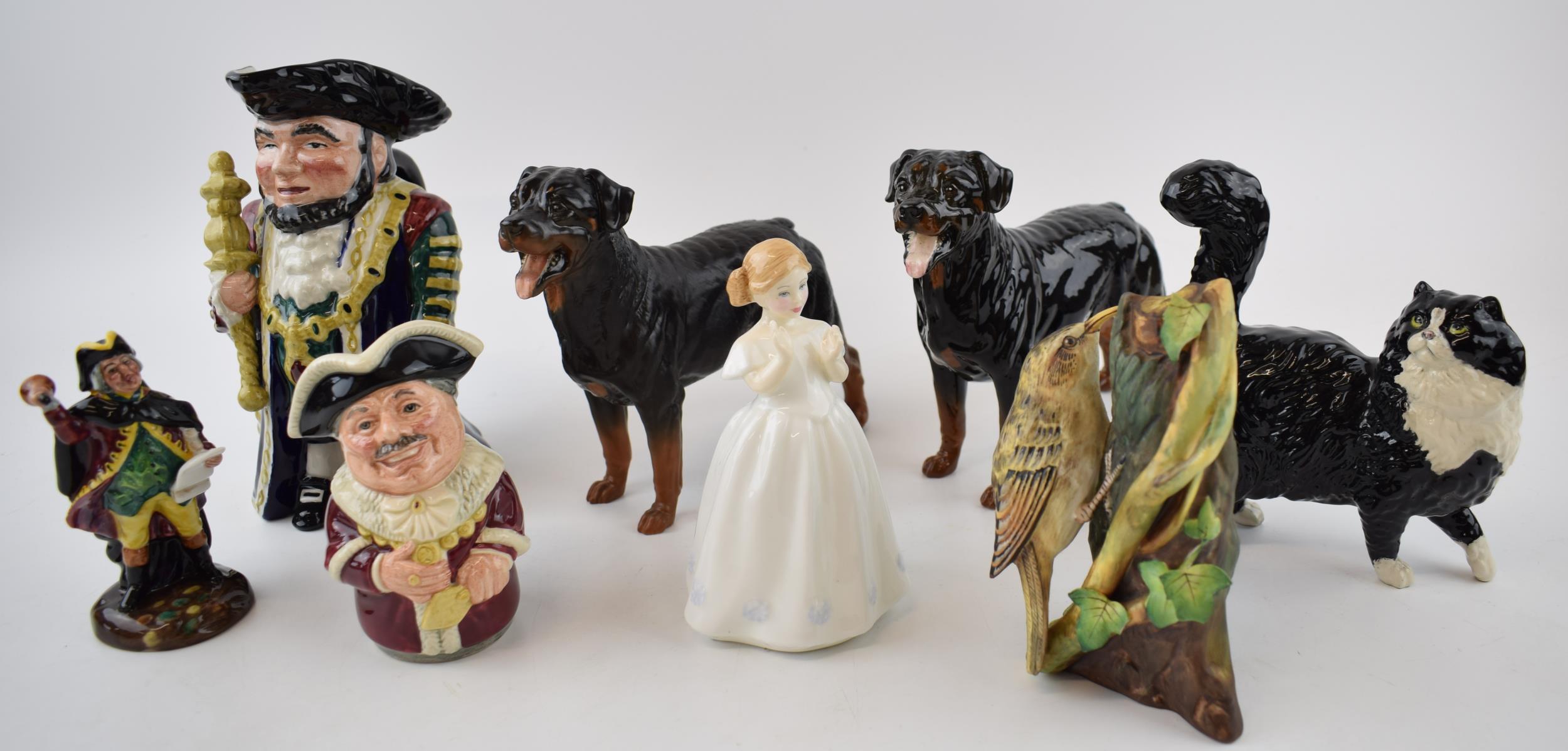 A collection of ceramic items to include Two Royal Doulton Rottweiler dogs, a black and white cat, a