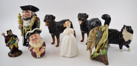 A collection of ceramic items to include Two Royal Doulton Rottweiler dogs, a black and white cat, a