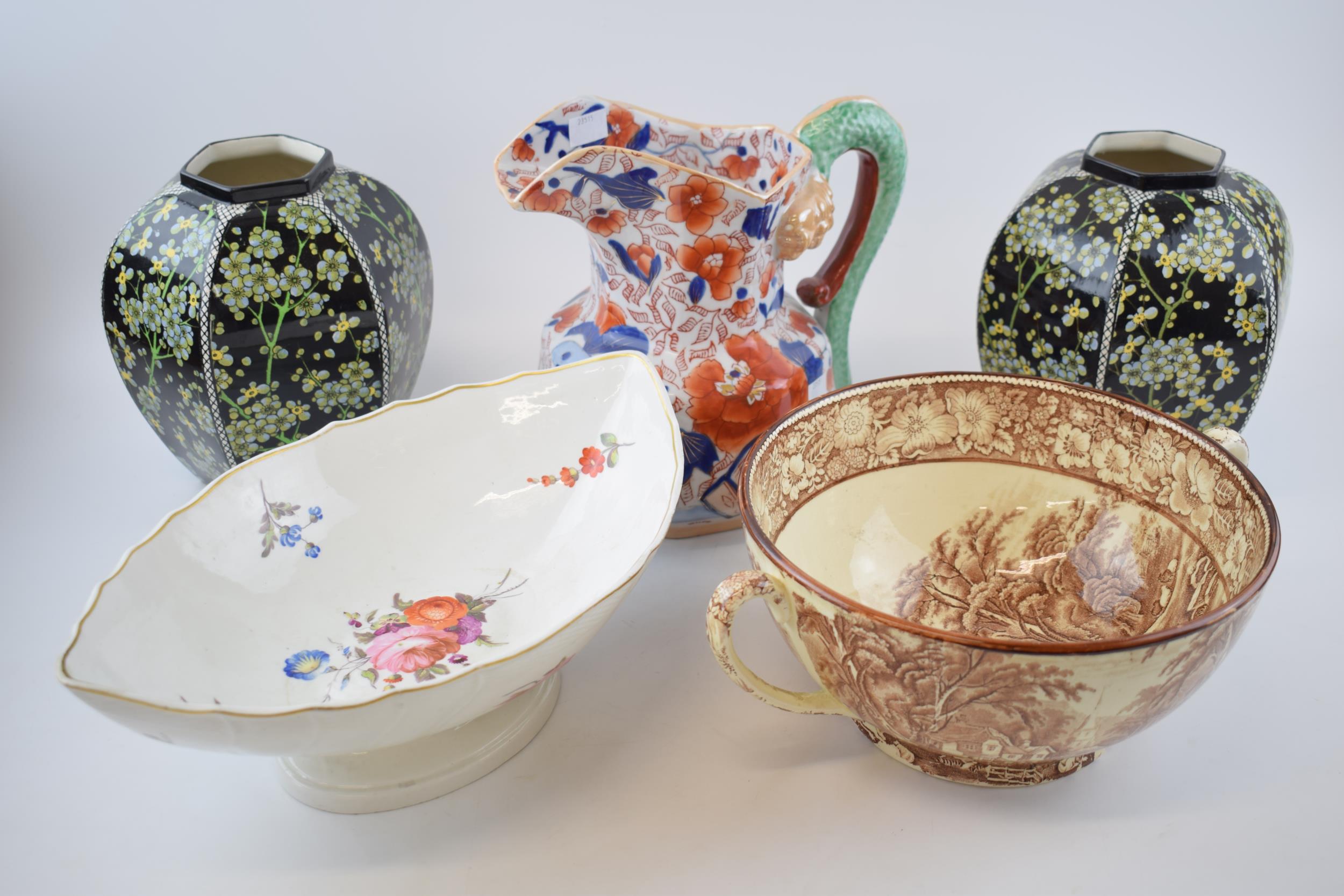 Pottery to include a 19th century English pottery floral comport with a pair of Royal Doulton