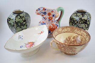 Pottery to include a 19th century English pottery floral comport with a pair of Royal Doulton