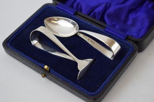 Cased silver christening set to include a spoon and a pusher, Birmingham 1923, 46 grams.