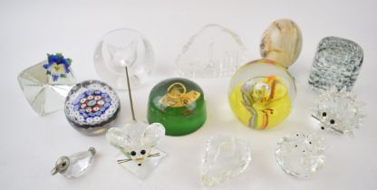 A collection of glass paperweights to include Caithness Saffron, a millefiori example, Swarovski